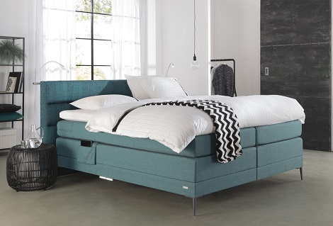 OptiSleep boxspring 6000 in petrol De Ploeg stof met gestoffeerde tablethouder